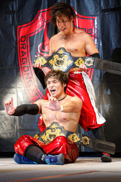 Lee & Kamei pose with the Open the Twin Gate tag team title belts