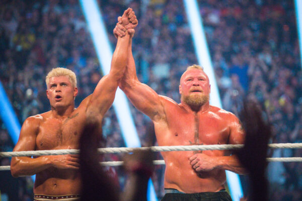 Brock Lesnar raises the hand of Cody Rhodes after their match at SummerSlam 2023